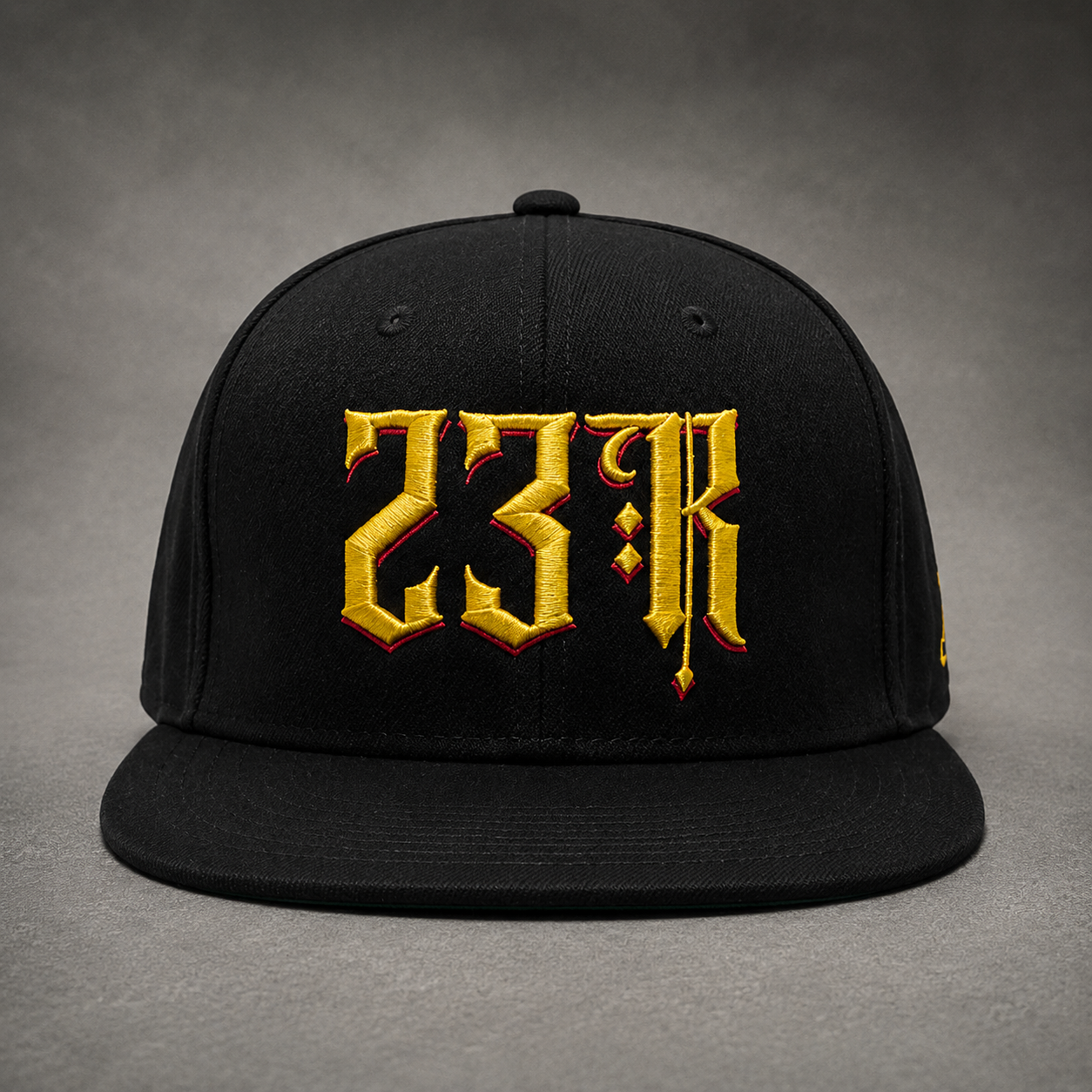 Black 23Ravens snapback cap with gold gothic embroidery front view