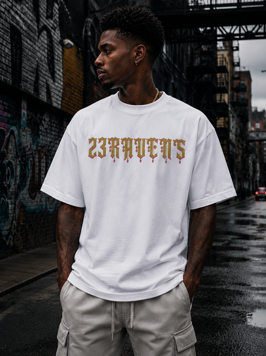 Model wearing white 23Ravens oversized t-shirt with gothic gold logo in urban streetwear setting