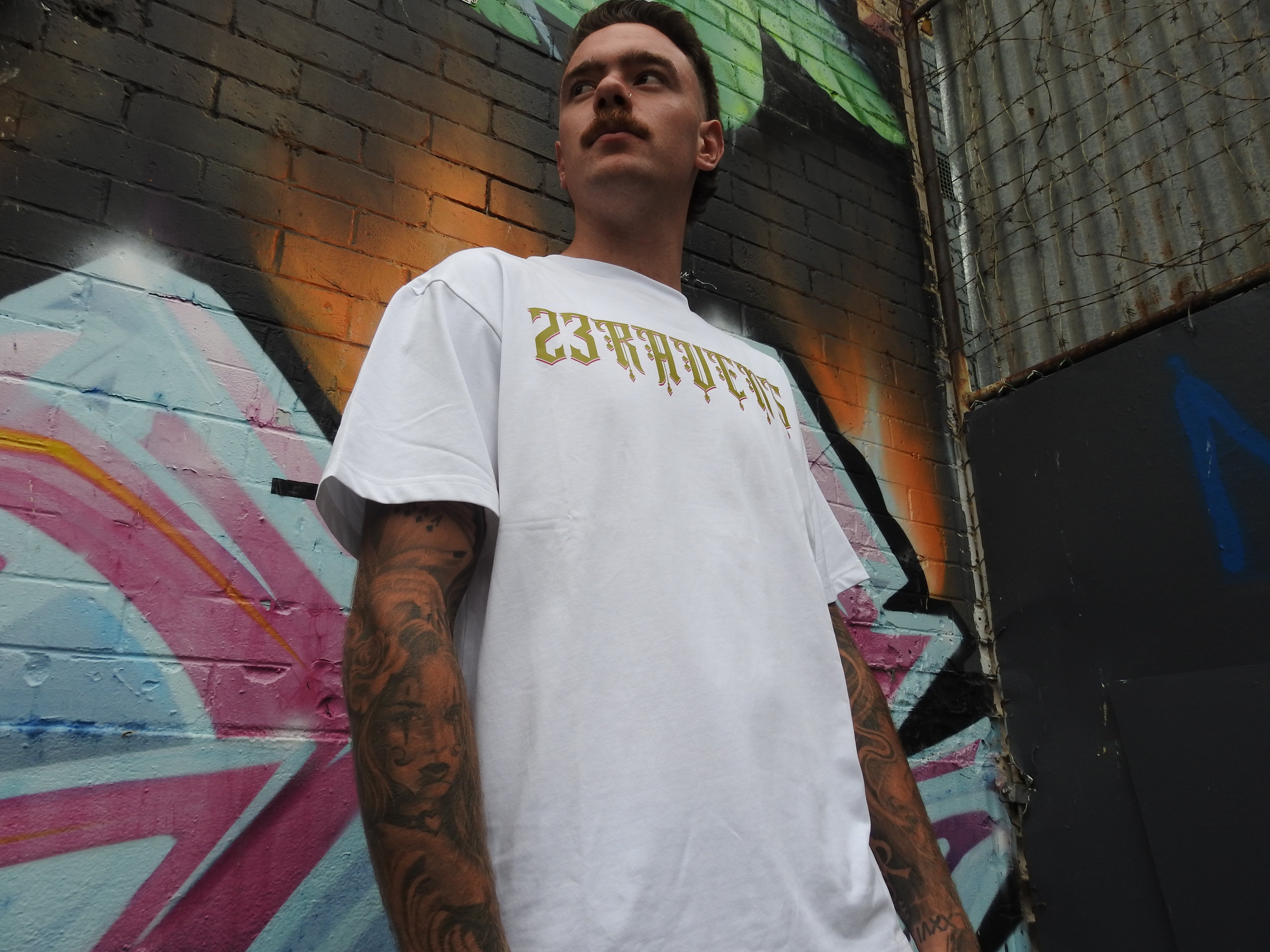 Man wearing a black 23Ravens t-shirt